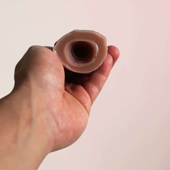 Masturbator with an opening